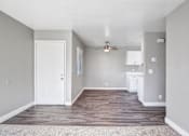 Thumbnail 42 of 63 - A room with a white door and a ceiling fan at The Henley Apartments, Suisun City