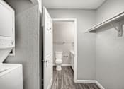 Thumbnail 53 of 63 - A small bathroom with a toilet and a white cabinet at The Henley Apartments, Suisun City, California