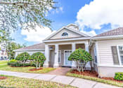 Thumbnail 4 of 24 - A house with a front porch and a tree in front at The Villages on Millenia Apartments, Orlando 32839