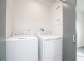 Thumbnail 26 of 29 - White washing machine at Bridge Meadows Redmond Apartments, Oregon, 97756