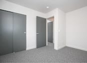 Thumbnail 24 of 29 - Room with grey carpet at Bridge Meadows Redmond Apartments, Redmond
