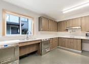 Thumbnail 15 of 29 - Modern kitchen at Bridge Meadows Redmond Apartments, Oregon