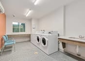 Thumbnail 16 of 29 - Laundry room at Bridge Meadows Redmond Apartments, Redmond, Oregon