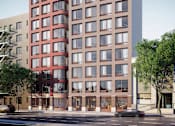 Thumbnail 20 of 22 - A red and brown building with many windows is shown.