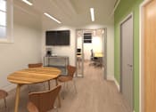 Thumbnail 6 of 9 - A conference room with a table and chairs.