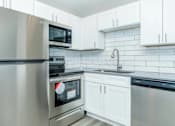 Thumbnail 9 of 12 - Modern Kitchen at Dash Apartments, Las Vegas, NV, 89104