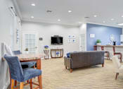 Thumbnail 5 of 20 - Living Room with Grey Couch at PALMETTO RIDGE Apartments, Florida