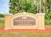 Thumbnail 8 of 20 - Property Sign at PALMETTO RIDGE Apartments, TITUSVILLE, FL
