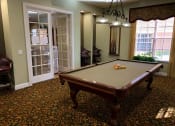 Thumbnail 11 of 20 - Portofino Apartments game room with pool table at Portofino, Palm Springs, Florida