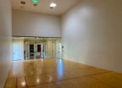 Thumbnail 12 of 20 - Portofino Apartments indoor racquetball court at Portofino, Palm Springs