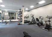 Thumbnail 13 of 22 - a large fitness room with treadmills and other exercise equipment at QUINN BY VINTAGE, Shoreline, WA