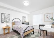 Thumbnail 17 of 22 - a bedroom with a bed and a desk at QUINN BY VINTAGE, Shoreline, WA, 98155