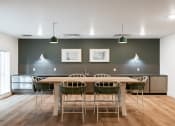 Thumbnail 5 of 22 - a conference room with a long wooden table and chairs at QUINN BY VINTAGE, Shoreline, WA