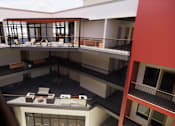 Thumbnail 3 of 7 - A balcony with chairs and a table is visible from an upper floor at Vintage at Lockwood Apartments, Oxnard 93036