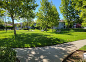 Thumbnail 6 of 21 - Lush greenery surrounding community at DOVER WOODS SENIOR APARTMENTS, Fairfield, CA 94533