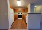 Thumbnail 8 of 21 - Full kitchen with lots of counter space at DOVER WOODS SENIOR APARTMENTS, Fairfield California