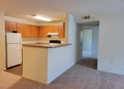 Thumbnail 7 of 21 - Full size kitchen overlooking living area at DOVER WOODS SENIOR APARTMENTS, California, 94533