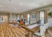 Thumbnail 24 of 48 - Apartments in Airway Heights for Rent - Salish Flats - Office Area with Meeting Table, Seating Area, Spacious Windows, and Coffee Table at Salish Flats APARTMENTS, Washington