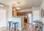 Thumbnail 4 of 48 - kitchen with bar and barstools at Salish Flats APARTMENTS, Airway Heights, WA