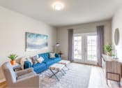 Thumbnail 5 of 48 - living room with couches and doors to patio at Salish Flats APARTMENTS, Washington