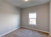Thumbnail 16 of 48 - bedroom with window and carpeting at Salish Flats APARTMENTS, Airway Heights, WA