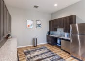 Thumbnail 25 of 48 - image of the kitchen in the clubhouse at Salish Flats APARTMENTS, Airway Heights, WA