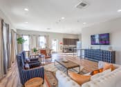 Thumbnail 23 of 48 - clubhouse with couches and table at Salish Flats APARTMENTS, Airway Heights, WA