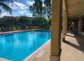 Thumbnail 5 of 13 - style pool and seating at Sanctuary Cove, Florida