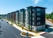 Thumbnail 5 of 27 - an aerial view of a large apartment complex with a road in front of it at STATION BY VINTAGE, COVINGTON Washington