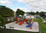 Thumbnail 15 of 18 - Outdoor playground at Siesta Pointe, Hialeah, FL