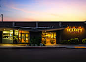 Thumbnail 76 of 81 - the facade of a restaurant at night with the door open
