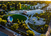 Thumbnail 78 of 81 - an aerial view of a campus with buildings and a water tower