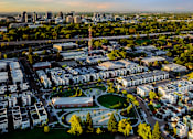 Thumbnail 81 of 81 - an aerial view of a city with buildings and a park