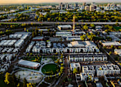 Thumbnail 80 of 81 - an aerial view of a city with buildings and cars
