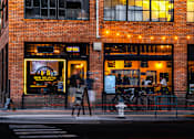 Thumbnail 72 of 81 - a street view of a restaurant on a city street at night