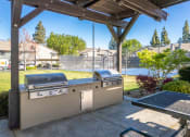 Thumbnail 9 of 19 - Covered BBQ area at THE EDGE Apartments, DAVIS, CA