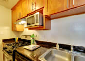 Thumbnail 15 of 26 - kitchen area with double sinks at THE POST Apartments, PLEASANT HILL 