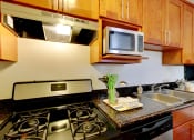 Thumbnail 14 of 26 - Kitchen area with stainless steel appliances at THE POST Apartments, PLEASANT HILL , CA 94523