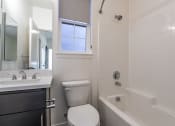 Thumbnail 35 of 41 - a bathroom with a toilet sink and bathtub at THE ANGELINO, Sacramento
