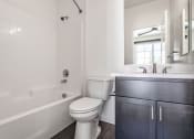 Thumbnail 39 of 41 - a bathroom with a toilet sink and bathtub at THE ANGELINO, Sacramento, CA