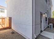 Thumbnail 37 of 41 - a view of the back of the house with a wooden fence and a wooden gate at THE ANGELINO, California, 95819