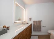 Thumbnail 12 of 33 - a bathroom with a sink and a mirror AT MIDTOWN Apartments, SACRAMENTO, CA, 90028