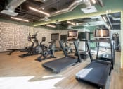 Thumbnail 6 of 33 - Studio Apartments in Downtown Sacramento, CA - Mod at Midtown - 24-Hour Fitness Center with Running Machines, Large Mirrors, and Plank Wood Flooring