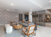 Thumbnail 4 of 33 - a living room with a couch and chairs and a wall with an oriental design at THE MOD AT MIDTOWN Apartments, SACRAMENTO, California