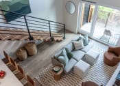 Thumbnail 22 of 24 - a view of the living room from the loft of a modern house with a couch at Luella, Sacramento, CA, 95811
