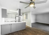 Thumbnail 8 of 31 - a kitchen and living room with a ceiling fan at Township Eastside, Portland, OR