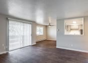 Thumbnail 10 of 31 - an empty living room with a sliding door to the kitchen at Township Eastside, Portland, OR, 06489