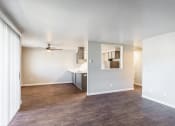 Thumbnail 9 of 31 - an empty living room with a ceiling fan at Township Eastside, Portland, Oregon