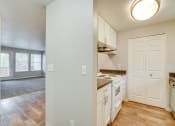 Thumbnail 5 of 46 - Kitchen with appliances near living room at TOWNSHIP Apartments, CANBY, Oregon