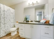Thumbnail 25 of 46 - Bathroom vanity and shower at TOWNSHIP Apartments, CANBY, OR 97013